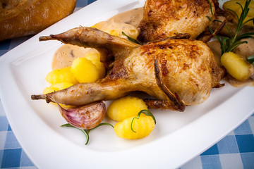 Fried quail with gravy, gnocchi, rosemary