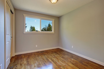Simplistic hardwood bedroom.