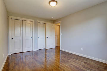 Simplistic hardwood bedroom.