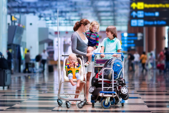 Family With Kids At Airport