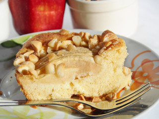 Piece of apple cake garnished with almonds