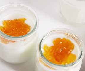 Nutritious and healthy breakfast with natural yogurt with apricot jam