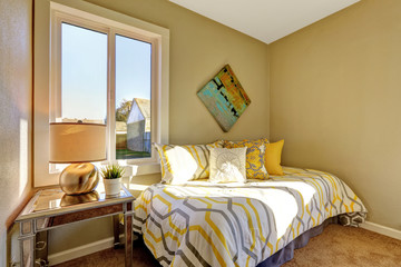 Bright bedroom with beige walls.