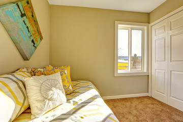 Bright bedroom with beige walls.