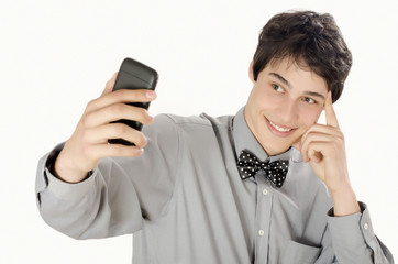 Happy businessman taking a selfie photo with his smart phone. Elegant man holding mobile phone.