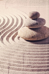 zen still life for spa and massage with sand and stones for balance and meditation with textured and contrast effects
