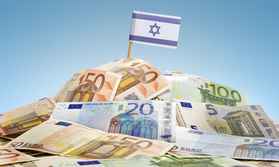 Flag of Israel sticking in a pile of various european banknotes.