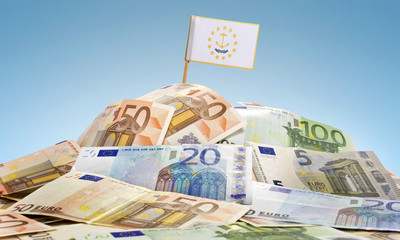 Flag of Rhode Island sticking in a pile of various european bank