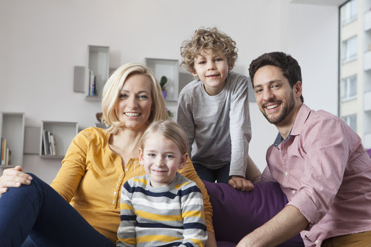 Portrait of happy family at home