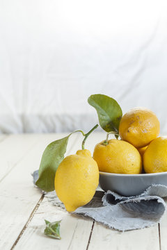 Fresh lemons with leaves