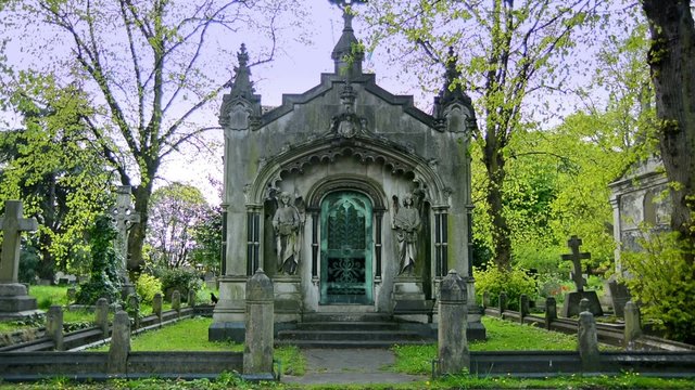 statues, crosses and tumbs in a cemetery