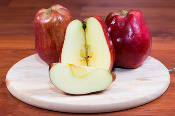 Naklejka na ściany i meble fresh red apple isolated on table background 