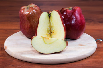 Naklejka na ściany i meble fresh red apple isolated on table background 