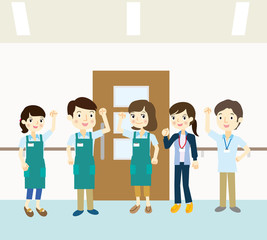 エプロンを着たスタッフチーム