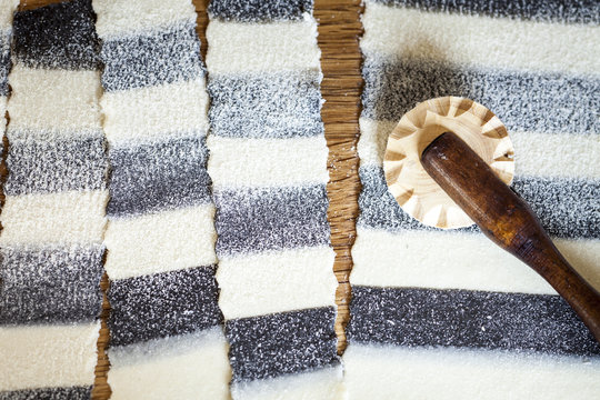 Homemade striped pasta, partly colored with cuttlefish ink