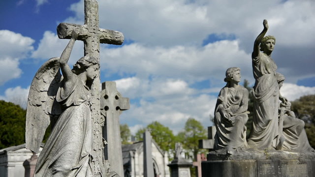 statues, crosses and tumbs in a cemetery
