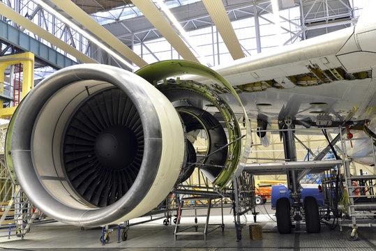 Jet engine of an unfinished airplane in a hangar
