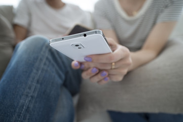 Couple relaxing at home sofa