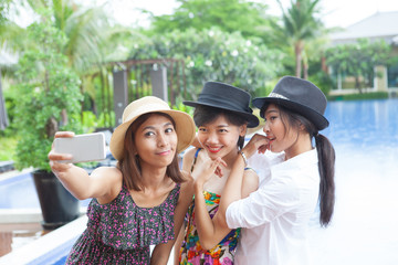 Fototapeta premium portrait of younger asian woman selfie by smart phone use for mo