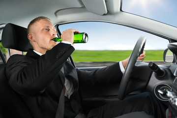 Man Drink's Beer While Driving Car