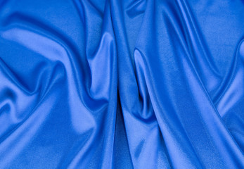 Blue silk cloth texture close up.