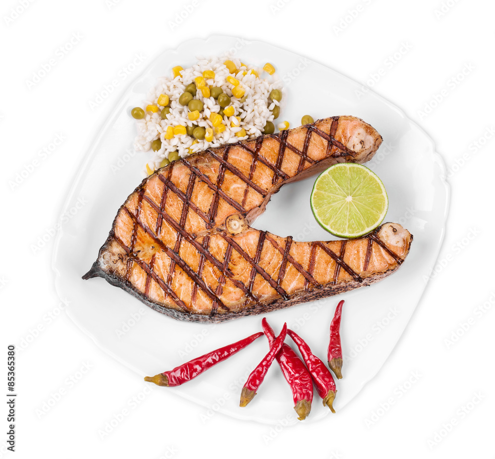 Wall mural Grilled salmon steak with vegetables on plate.