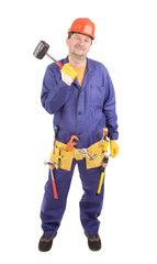 Worker in hard hat holds hammer.