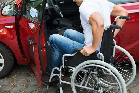 Disabled Man Boarding In His Car