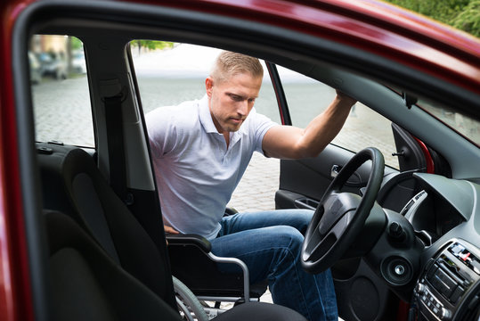 Disabled Man Boarding In His Car