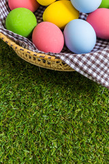 Colorful eggs in a basket