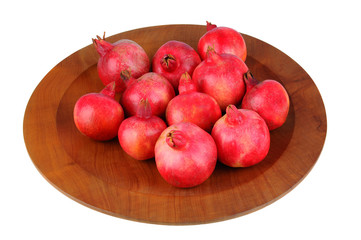 Fototapeta na wymiar Pomegranates on Wood Platter