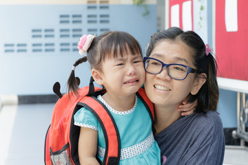 children and mother crying first day go to pre-kindergarten scho