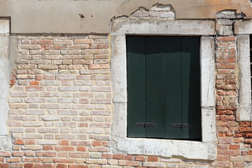 Old gungy wall with immured window
