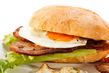 Breakfast - sandwich, egg, bacon and vegetables