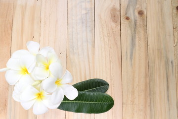 Fototapeta na wymiar Zen spa concept background - Zen massage stones with frangipani plumeria flower