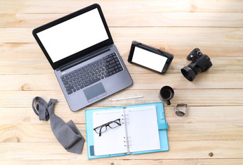 Creative professional's work items and tech gadgets from above