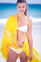 Pretty girl wearing a sarong on the beach