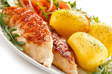 Grilled chicken fillets, boiled potatoes and vegetable salad 