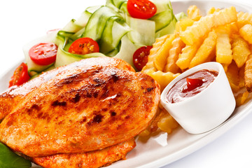 Fried chicken fillet, chips and vegetable salad 