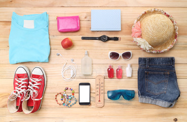 Outfit of traveler, student, teenager, young woman or guy. Overhead of essentials for modern young...