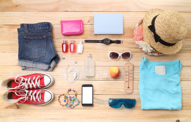 Outfit of traveler, student, teenager, young woman or guy. Overhead of essentials for modern young...