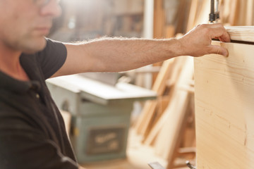 carpenter placing a wooden flap