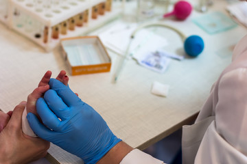 complete blood count/a drop of blood on a finger of the child