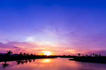 Sunset sky over lake.