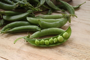 fresh beans broad over wood background, selective focus