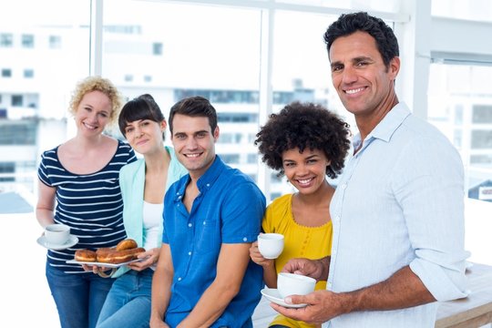 Business People Eating Donuts And Drinking