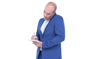  Young businessman writing on a notepad