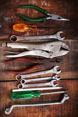 set of hand tools on a wooden panel