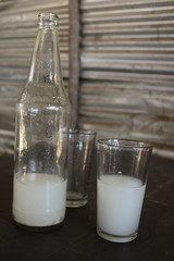 A bottle and glass of  traditional white Toddy Drink