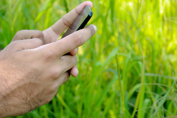 Teen chatting and playing with Smartphone